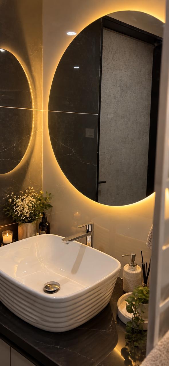Modern bathroom vanity with backlit round mirror